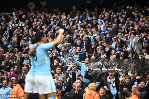 Manchester City fans celebrate their sides second goal during the Premier League match between Manchester City and Manchester United at Etihad...
