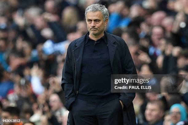 Manchester United's Portuguese manager Jose Mourinho reacts during the English Premier League football match between Manchester City and Manchester...