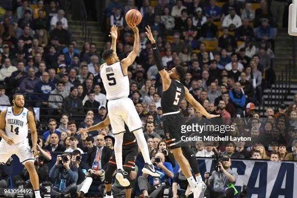 Phil Booth of the Villanova Wildcats takes a shot over Justin Gray of the Texas Tech Red Raiders during the 2018 NCAA Men's Basketball Tournament...
