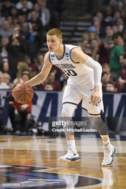 Donte DiVincenzo of the Villanova Wildcats dribbles the ball during the 2018 NCAA Men's Basketball Tournament East Regional against the Texas Tech...