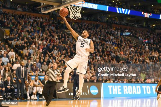 Phil Booth of the Villanova Wildcats drives to the basket during the 2018 NCAA Men's Basketball Tournament East Regional against the Texas Tech Red...