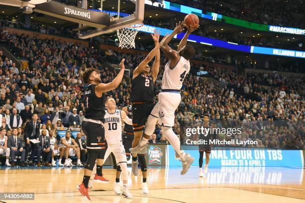 Eric Paschall of the Villanova Wildcats takes a shot over Zhaire Smith of the Texas Tech Red Raiders during the 2018 NCAA Men's Basketball Tournament...