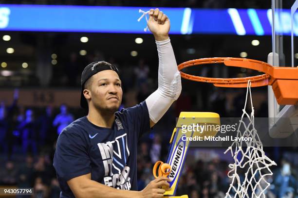 Jalen Brunson of the Villanova Wildcats cuts the net down after winning the 2018 NCAA Men's Basketball Tournament East Regional against the Texas...