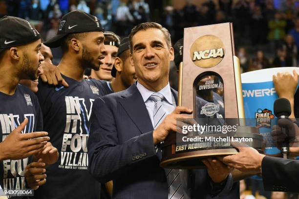 Head coach jay Wright of the Villanova Wildcats holds the East Regional trophy after the 2018 NCAA Men's Basketball Tournament East Regional against...