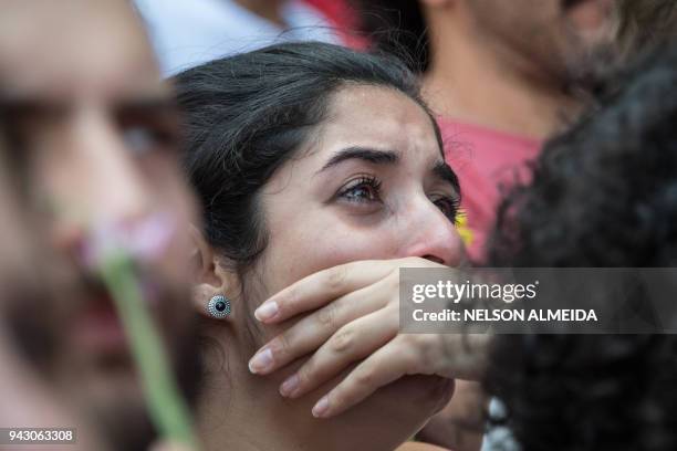 Supporter of Brazilian former president Luiz Inacio Lula da Silva reacts during his speech in the Metallurgical Union, in Sao Bernardo do Campo, Sao...