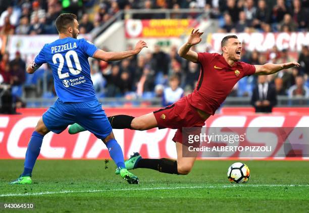 Fiorentina's Argentinian defender German Pezzella fights for the ball with Roma's forward from Bosnia ed Erzegovina Edin Dzeko during the Italian...