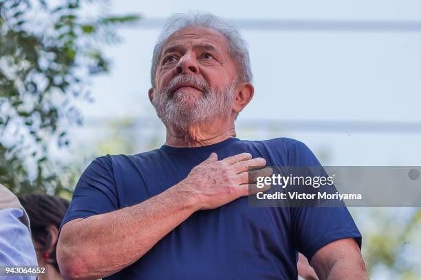 Former President Luiz Inacio Lula da Silva gestures to supporters at the headquarters of the Metalworkers' Union where a Catholic mass was held in...