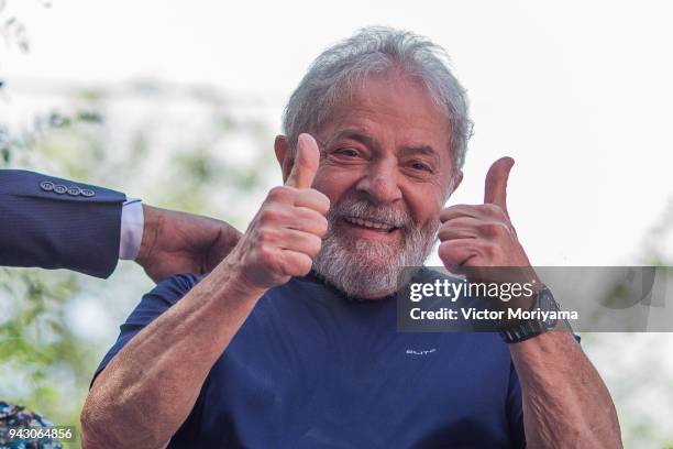 Former President Luiz Inacio Lula da Silva gestures to supporters at the headquarters of the Metalworkers' Union where a Catholic mass was held in...