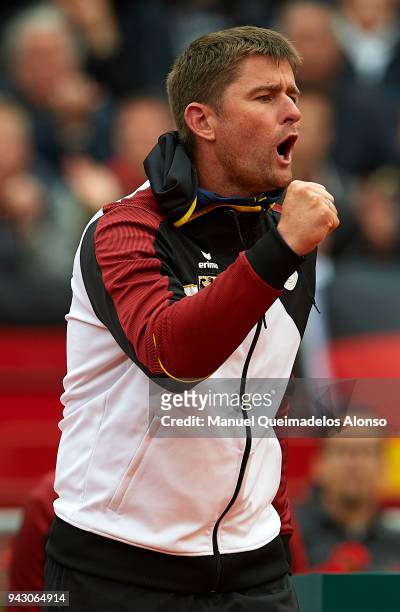 Captain Michael Kohlmann supports Tim Puetz and Jan-Lennard Struff of Germany in his match against Feliciano Lopez and Marc Lopez of Spain in the...