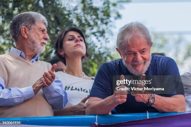 Former President Luiz Inacio Lula da Silva gestures to supporters at the headquarters of the Metalworkers' Union where a Catholic mass was held in...