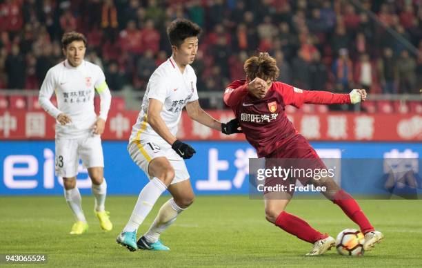 Gui Hong of Hebei China Fortune and Sun Jie of Changchun Yatai in action during the 2018 Chinese Super League match between Hebei China Fortune and...