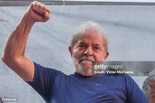 Former President Luiz Inacio Lula da Silva gestures to supporters at the headquarters of the Metalworkers' Union where a Catholic mass was held in...