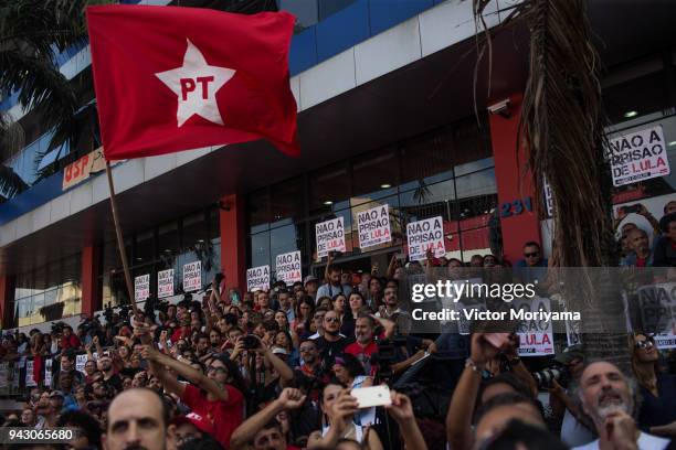 Supporters of former President Luiz Inacio Lula da Silva look on at the headquarters of the Metalworkers' Union where a Catholic mass was held in...