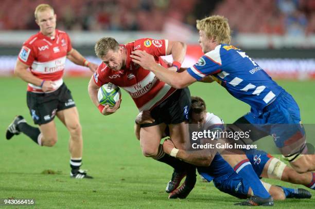 Ruan Combrinck of the Emirates Lions tackled by Pieter-Steph du Toit of the DHL Stormers during the Super Rugby match between Emirates Lions and DHL...