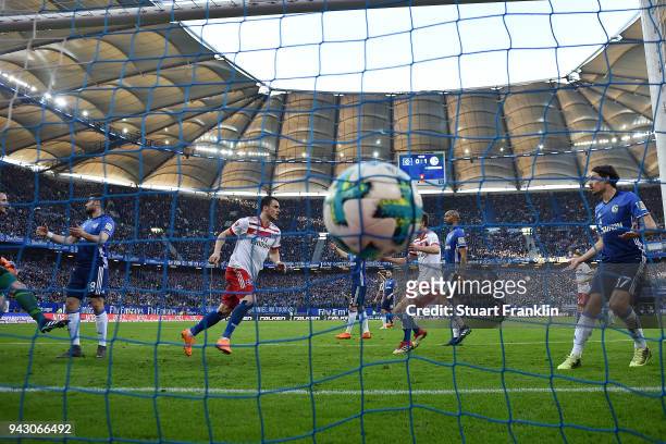 Filip Kostic of Hamburg scores a goal to make it 1:1 during the Bundesliga match between Hamburger SV and FC Schalke 04 at Volksparkstadion on April...