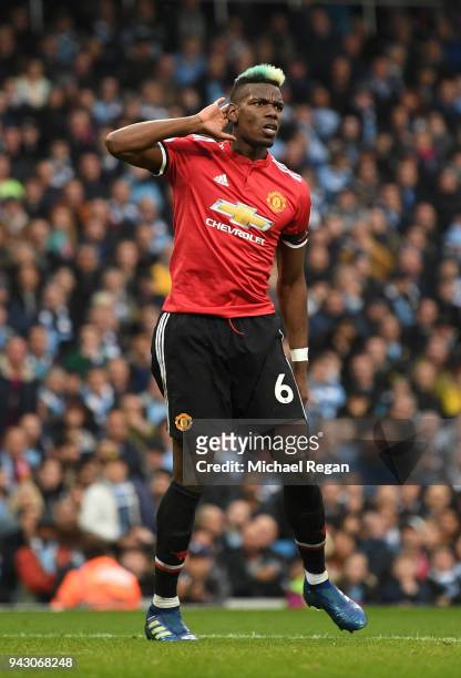 Paul Pogba of Manchester United celebrates after scoring his sides second goal during the Premier League match between Manchester City and Manchester...