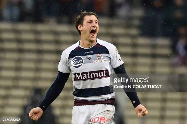 Bordeaux-Begles' French scrumhalf Baptiste Serin celebrates after scoring a try during the French Top 14 rugby union match between Bordeaux-Begles...