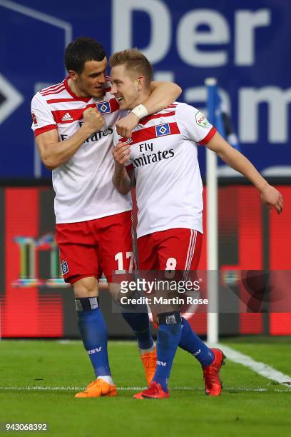 Lewis Holtby of Hamburg celebrates with Filip Kostic of Hamburg (l9 after he scored a goal to make it 2:1 during the Bundesliga match between...