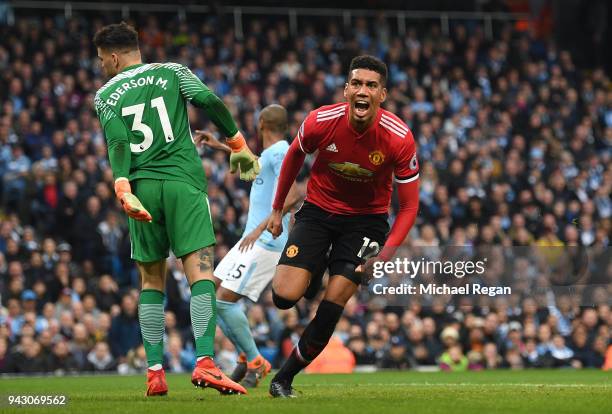 Chris Smalling of Manchester United celebrates scoring his side's third goal during the Premier League match between Manchester City and Manchester...