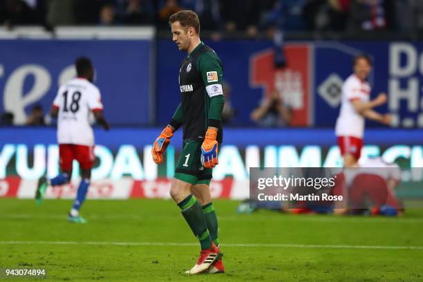 Goalkeeper Ralf Faehrmann of Schalke reacts after Aaron Hunt of Hamburg scored a goal to make it 3:2 during the Bundesliga match between Hamburger SV...