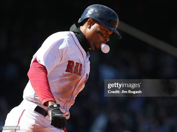 Xander Bogaerts of the Boston Red Sox runs the bases after hitting a grand slam home run against the Tampa Bay Rays in the second inning at Fenway...