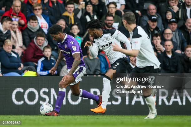 Bolton Wanderers' Mark Little breaks away from Derby County's Kasey Palmer and Chris Baird during the Sky Bet Championship match between Derby County...