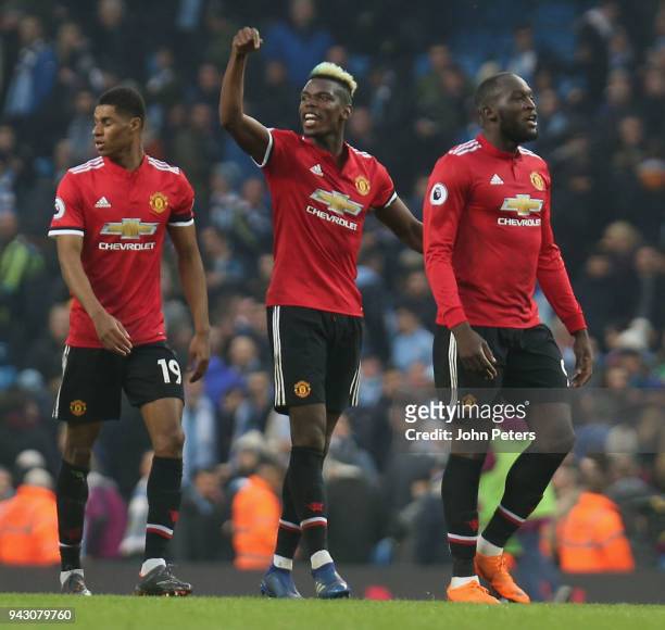 Paul Pogba and Romelu Lukaku of Manchester United celebrate after the Premier League match between Manchester City and Manchester United at Etihad...