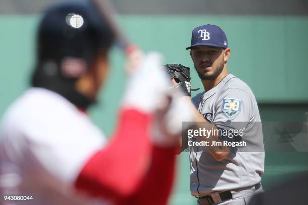 Pitcher Jacob Faria of the Tampa Bay Rays readies for the pitch against Mookie Betts of the Boston Red Sox in the first inning at Fenway Park, on...