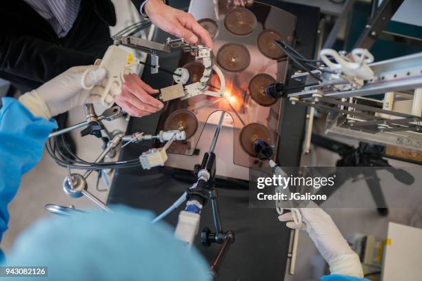 medical students practicing for keyhole surgery - robot surgery stock pictures, royalty-free photos & images