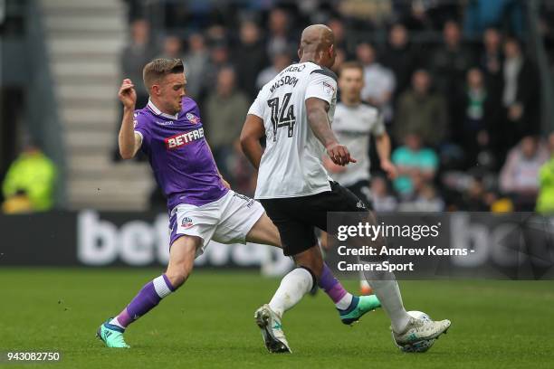 Bolton Wanderers' Craig Noone vies for possession with Derby County's Andre Wisdom during the Sky Bet Championship match between Derby County and...