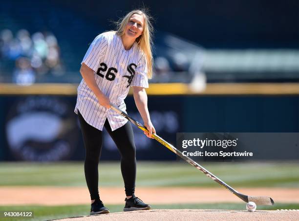 Womens National Team and Olympic gold medalist Kendall Coyne hits the ceremonial first pitch before the game between the Chicago White Sox and the...