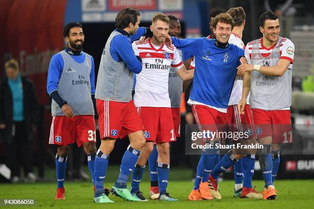 Aaron Hunt of Hamburg is celebrated by his team mates after the Bundesliga match between Hamburger SV and FC Schalke 04 at Volksparkstadion on April...