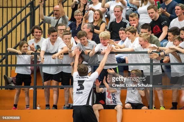 Fans celebrate a goal with Alberto Scalera of Koeln during the quarter final match of the German Futsal Championship 2018 between Futsal Panthers...
