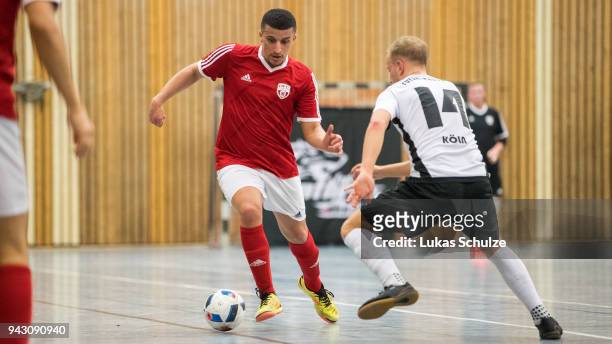 Youness Ben Mustapha of Hamburg and Niclas Hoffmans of Koeln in action during the quarter final match of the German Futsal Championship 2018 between...