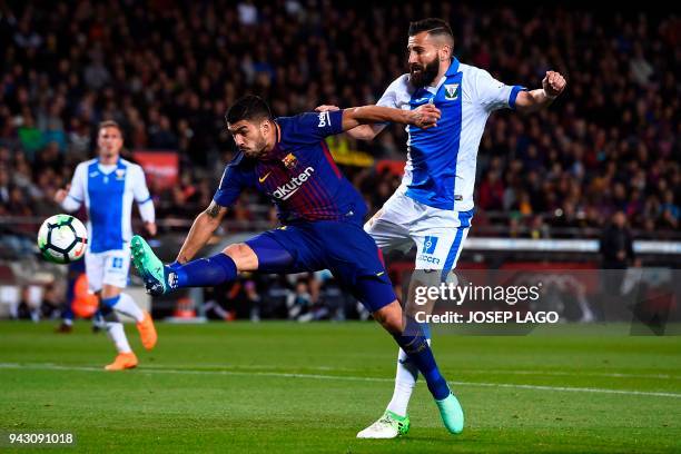 Leganes' Greek defender Dimitrios Siovas challenges Barcelona's Uruguayan forward Luis Suarez during the Spanish league football match between...