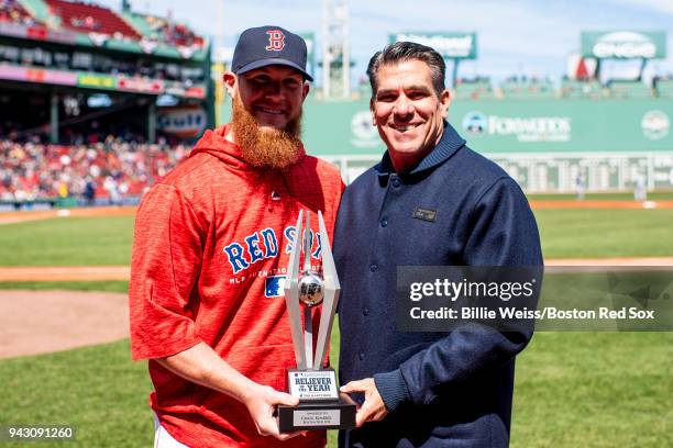 Craig Kimbrel of the Boston Red Sox is presented with the 2017 Reliever of the Year award before a game against the Tampa Bay Rays on April 7, 2018...