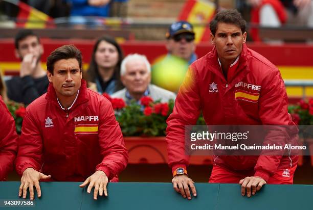 David Ferrer and Rafael Nadal of Spain react for Feliciano Lopez and Marc Lopez of Spain in action againist Tim Puetz and Jan-Lennard Struff of...