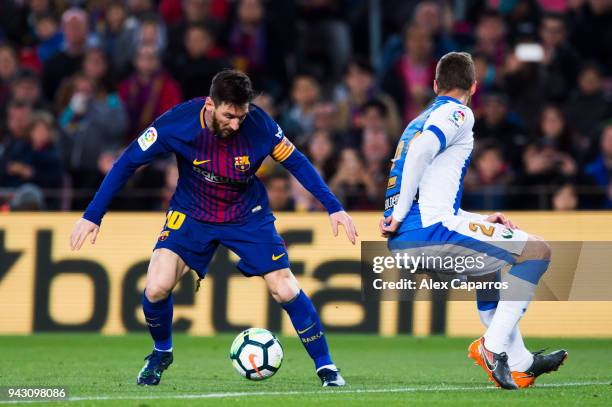 Lionel Messi of FC Barcelona dribbles Ruben Perez of CD Leganes during the La Liga match between Barcelona and Leganes at Camp Nou on April 7, 2018...