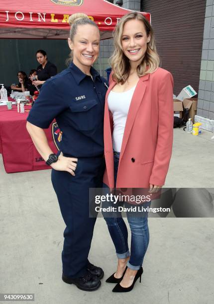 S "Station 19" cast member Danielle Savre poses with her sister/LAFD member Stephanie Savre at LAFD Girls Camp on April 7, 2018 in Panorama City,...