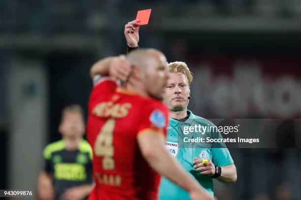 Ron Vlaar of AZ Alkmaar receives a red card from referee Kevin Blom during the Dutch Eredivisie match between AZ Alkmaar v PSV at the AFAS Stadium on...