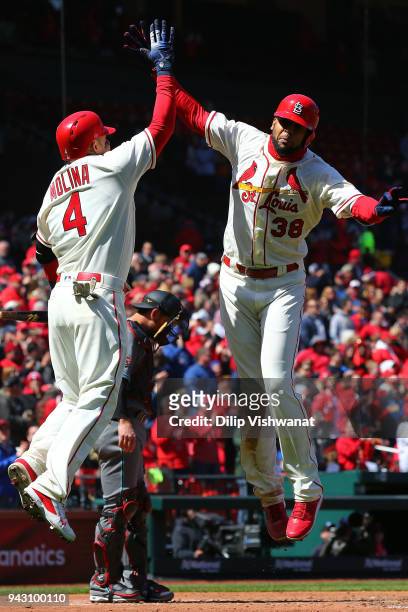 Carlos Martinez of the St. Louis Cardinals celebrates with Yadier Molina of the St. Louis Cardinals after hitting a three-run home run against the...