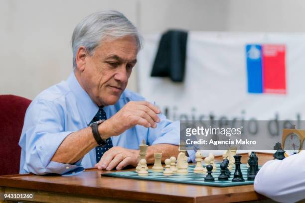 President of Chile, Sebastián Piñera plays chess during the celebration of Sports Day at the Palace of La Moneda, on April 06, 2018 in Santiago,...