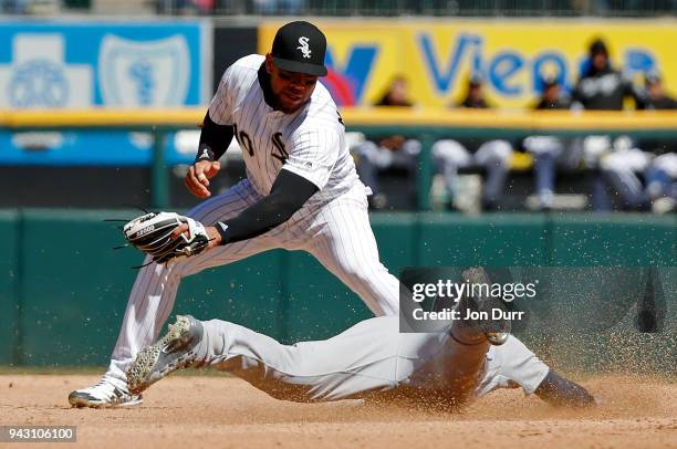 JaCoby Jones of the Detroit Tigers steals second base as Yoan Moncada of the Chicago White Sox is late on the tag during the fourth inning at...