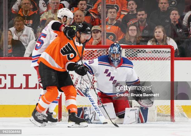 Henrik Lundqvist of the New York Rangers blocks the net during the first period against Michael Raffl of the Philadelphia Flyers at the Wells Fargo...