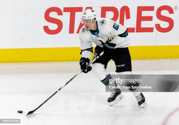 San Jose Sharks defenseman Justin Braun looks to pass the puck during the first period of a regular season game between the San Jose Sharks and the...