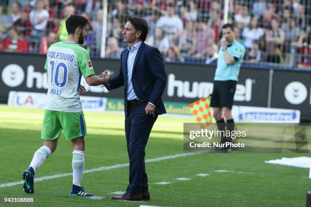 Malli Yunus 10 and Bruno Labbadia coach of Wolfsburg during the Bundesliga match between Sport-Club Freiburg and VfL Wolfsburg at Schwarzwald-Stadion...