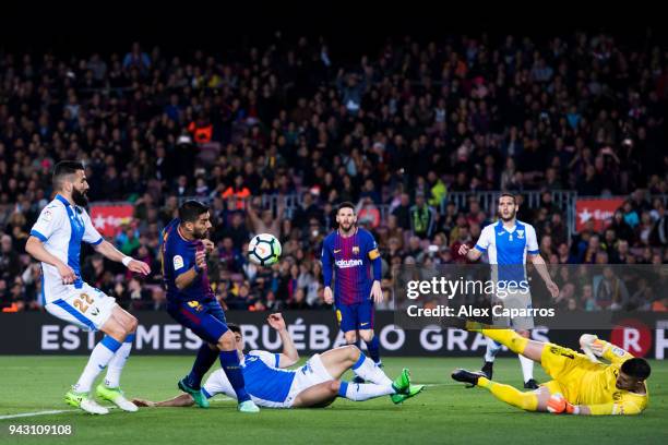 Goalkeeper Ivan Cuellar of CD Leganes saves a header from Luis Suarez of FC Barcelona during the La Liga match between Barcelona and Leganes at Camp...