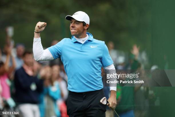 Rory McIlroy of Northern Ireland celebrates making eagle on the eighth hole during the third round of the 2018 Masters Tournament at Augusta National...