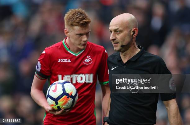 Sam Clucas of Swansea City talks to Referee Roger East during the Premier League match between West Bromwich Albion and Swansea City at The Hawthorns...