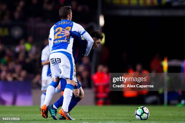 Ruben Perez of CD Leganes fouls Lionel Messi of FC Barcelona during the La Liga match between Barcelona and Leganes at Camp Nou on April 7, 2018 in...